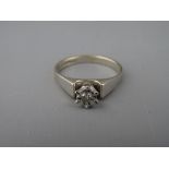 AN EIGHTEEN CARAT WHITE GOLD DIAMOND SOLITAIRE DRESS RING, visual estimate of diamond 0.3 carat, 4