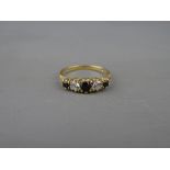 A NINE CARAT GOLD SAPPHIRE (THREE) & CZ (TWO) DRESS RING, 2 grms, size 'N'