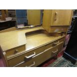 AN EARLY G-PLAN LIGHT WOOD BEDROOM SUITE of two door wardrobe, dressing table, gent's wardrobe/chest