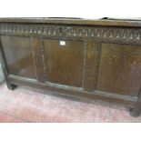 AN 18th CENTURY OAK BLANKET CHEST, panelled top front and sides with simple carved detail to the