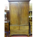 A GEORGIAN MAHOGANY PRESS CUPBOARD, the twin door upper section with interior slide drawers over two