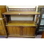 AN EDWARDIAN MAHOGANY DUMB WAITER with gallery back on turned shelf supports with twin lower