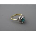 AN EIGHTEEN CARAT GOLD BLUE QUARTZ & DIAMOND OVAL CLUSTER DRESS RING, 3.5 grms gross, size 'N'