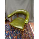 AN EDWARDIAN MAHOGANY & GREEN LEATHER OFFICE CHAIR, the curved back on turned gallery with shaped