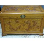 AN EXCELLENT ORIENTAL CAMPHOR WOOD CHEST with dragon design to the front and top, two interior