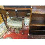 A LATE 19th/EARLY 20th CENTURY BOW FRONT MAHOGANY SIDE TABLE with two drawers having brass handles