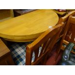 Modern light wood foldover 'Julian Bowen' circular breakfast table and four matching check