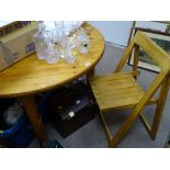Circular pine table and four folding chairs