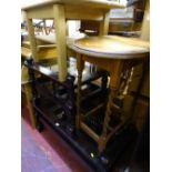 Dark wood glass topped coffee table with lower slats, another matching but smaller, a light wood