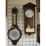 Polished balloon barometer and a modern Vienna style wall clock