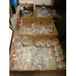 Four boxes containing a large collection of drinking glassware and miscellaneous glassware