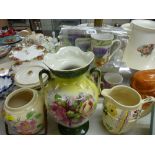 Two pottery biscuit barrels, a twin handled vase, two boxed china mug and coaster sets etc