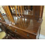 Polished mirror backed sideboard, the top having shelved pillars to a base of two drawers and two