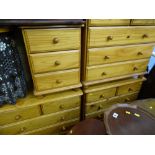 Three similar pine two over three drawer chests and one three drawer bedside chest