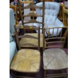 Rush seated ladderback elbow chair and two other similar rush seated chairs