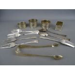 Four hallmarked silver napkin rings, a pair of sugar tongs, two teaspoons and five pastry forks, 6.5