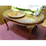 Oval hardwood extending dining table with two extra leaves and a 'Lazy Susan'