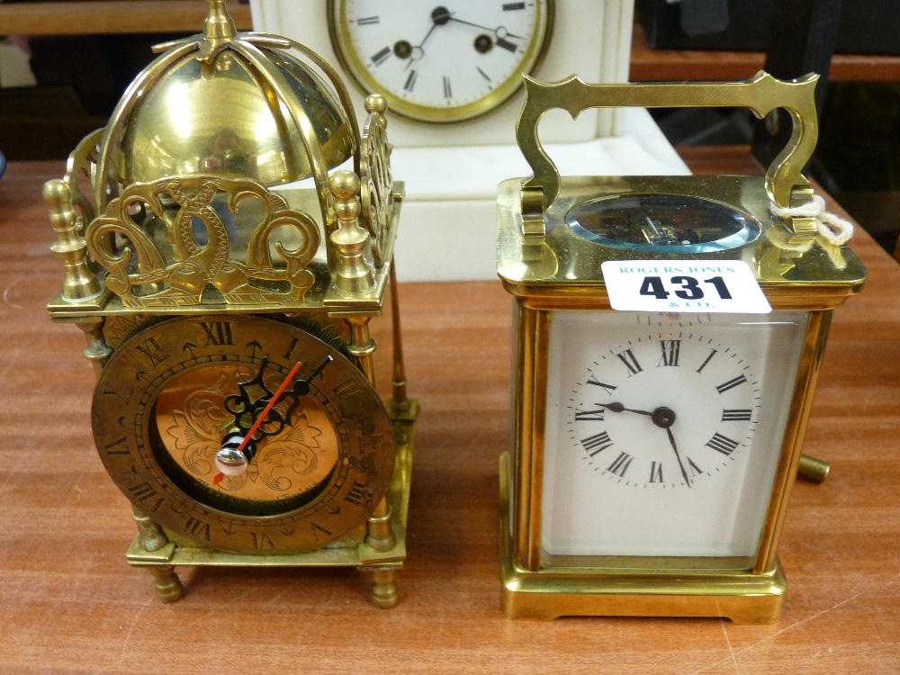 20th Century brass cased four pane carriage clock with key and a reproduction brass lantern clock