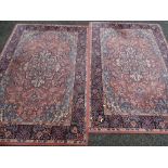 Two similar patterned rugs