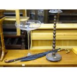 Large Babycham style decorative glass, bobbin style smoker's bow, walking stick and an umbrella