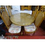 Circular Bergere glass topped table and four matching dining chairs