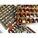 Three racks of thimbles, Wade Whimsies and other miniature ornaments Condition reports provided on