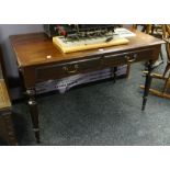 Victorian mahogany two-drawer writing table / desk raised on four turned tapering legs, 121cms