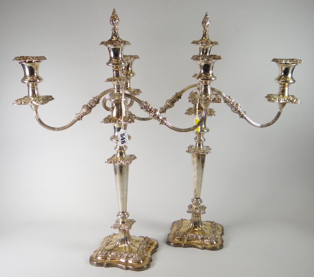 Pair of silver plated two-branch candelabra overall with scroll and foliate decoration and