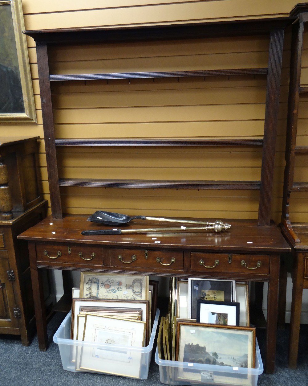 A three-drawer dresser with platform base and open rack, 155cms wide Condition reports provided on