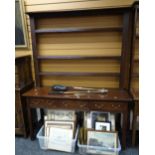 A three-drawer dresser with platform base and open rack, 155cms wide Condition reports provided on