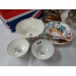 A nineteenth century Chinese footed rice bowl, two similar tea bowls and a Moore Brothers Japan
