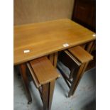 A mid-century nest of tables with the four smaller tables folding out Condition reports provided