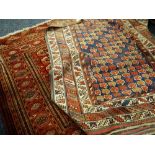 Two Persian red ground rugs geometric borders, 174 x 124cms & 116 x 138cms Condition reports