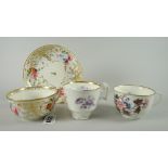 A Swansea porcelain shallow breakfast cup & saucer decorated profusely with gilding and sprays of