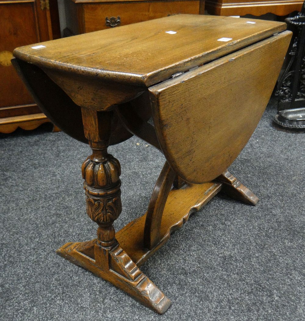A good antique reproduction drop-leaf oval table having carved bulbous supports Condition reports
