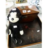 A nineteenth century mahogany sarcophagus tea caddy, a vintage Merrythought character soft toy and a