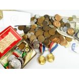 A good parcel of commemorative and loose coinage together with a tin of medals and medallions