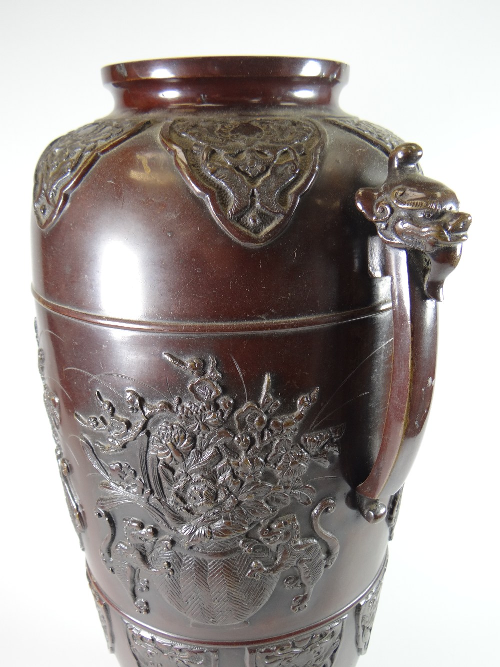 A tall bronze Chinese temple vase of ovoid form on four dragon feet and with beast-mask terminals to - Image 2 of 3