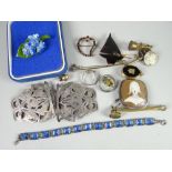 An interesting jewellery lot including a rounded rectangular silver framed cameo brooch of a choir