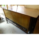 A retro mixed wood mid-century sideboard with two drawers and two cupboards 132cms wide Condition
