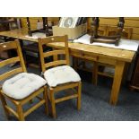 A twentieth century farmhouse table with centre drawer, 126cms long together with four ladder back