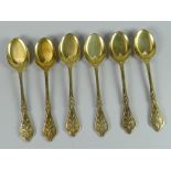A set of six Victorian silver gilt teaspoons by George Adams for Chawner & Co, of floral design, the