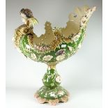 An imposing Majolica-style continental pottery table centrepiece with cherubic head and with