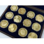 A cased set of twelve Elizabeth II commemorative gold plated medallions Condition reports provided