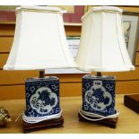 A pair of modern decorative Chinese-style blue & white table lamps of square based form on