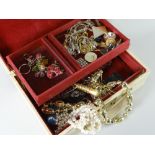 A vintage lockable jewellery box and assorted contents Condition reports provided on request by