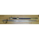 An antique British Naval Officer's sword having wire bound fish grip handle with lion's head pommel,