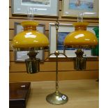 A vintage brass twin-branch reading oil lamp Condition reports provided on request by email for this