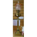 A Thermidor Belge brass architectural antique oil lamp on a stepped base with Romanesque support and