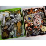 A box of costume jewellery and a box of small collectables including watch, love spoon, loose bank